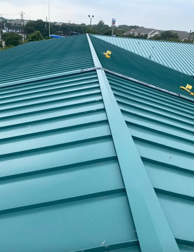 Green commercial metal roof ridge and valley for Metal Roof Repair in Livonia